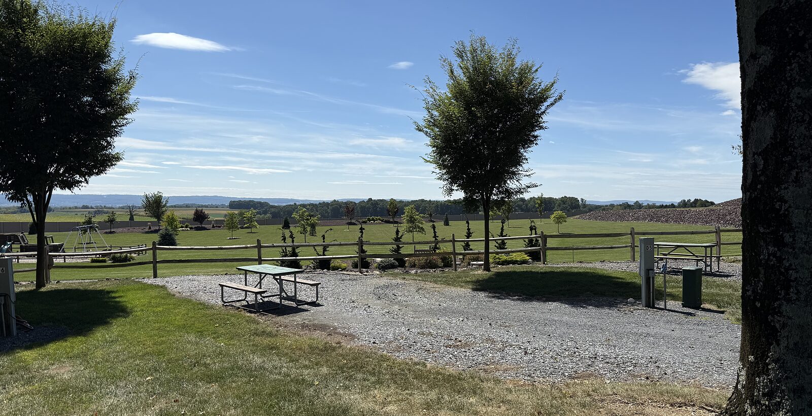 A campsite with picnic table looking out over the valley
